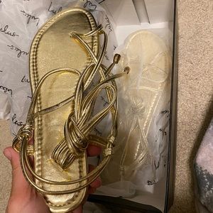 Never worn gold sandals. Size 8